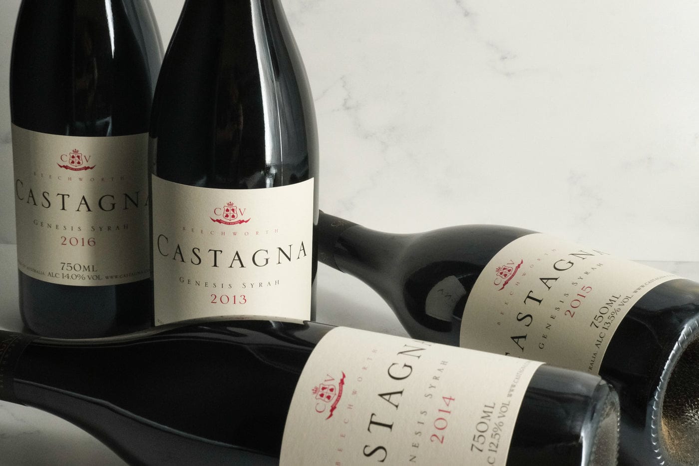 Castagna Genesis Syrah bottles on marble